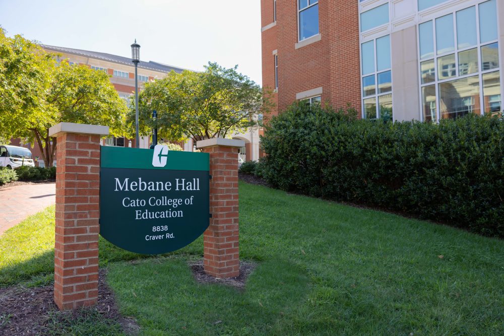Photograph of Mebane Hall's signage on a sunny day.